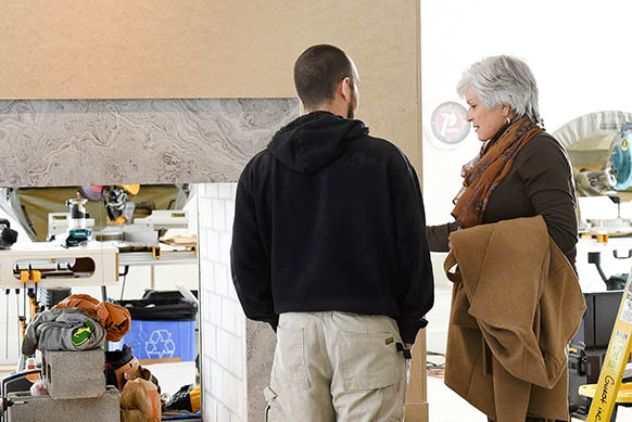 Jane Cameron reviewing a project with a client on site