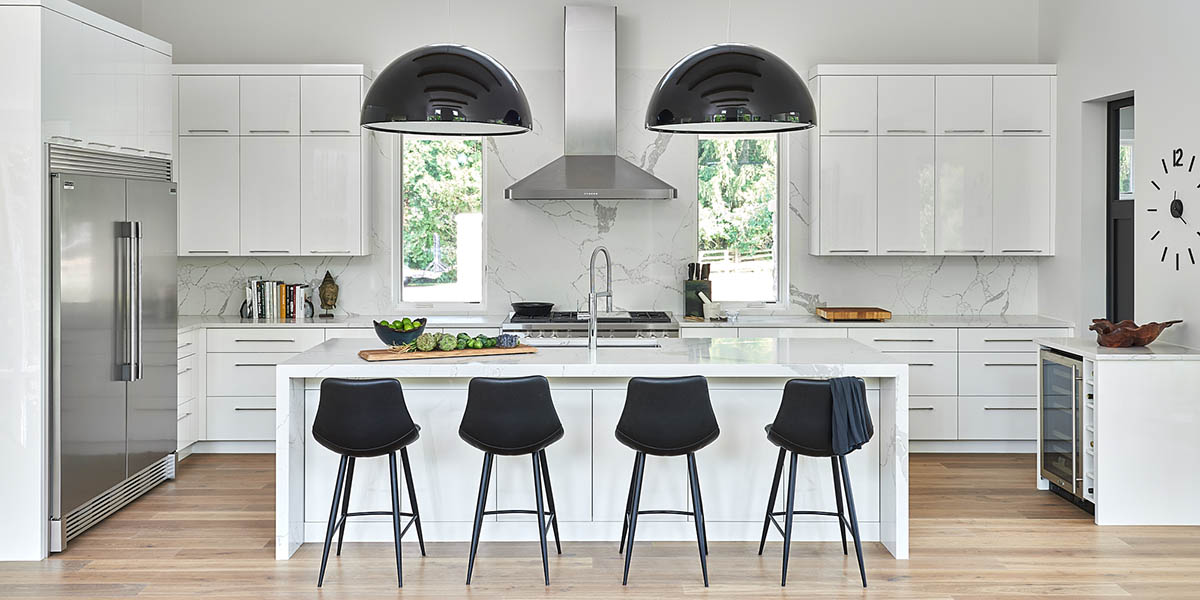 Bright white kitchen with a long island