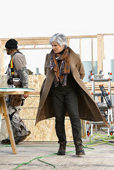 Jane Cameron with a crew member on a home under construction