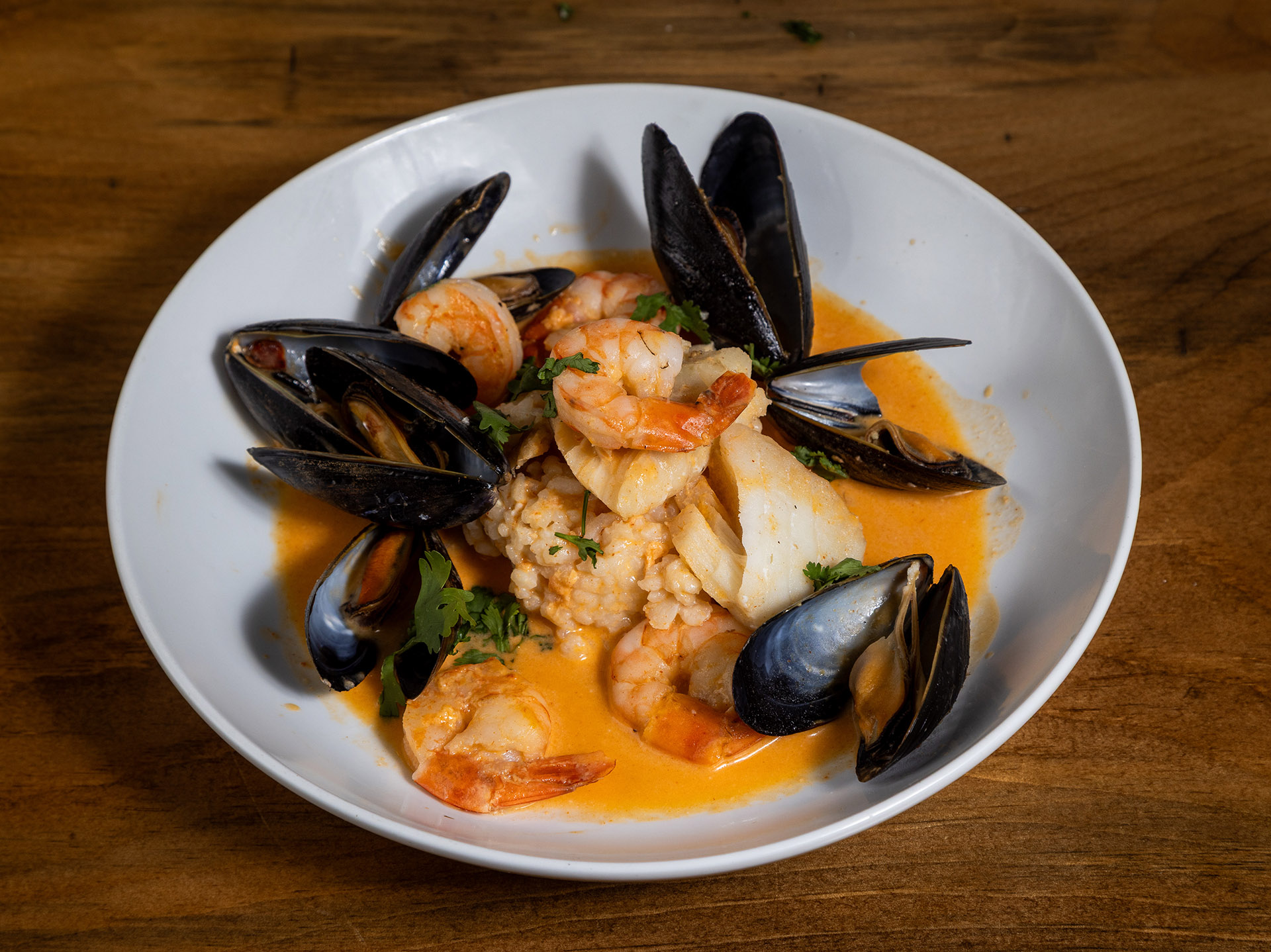 Seafood bowl with shrimp, mussels, and fish at The Curly Willow Eatery