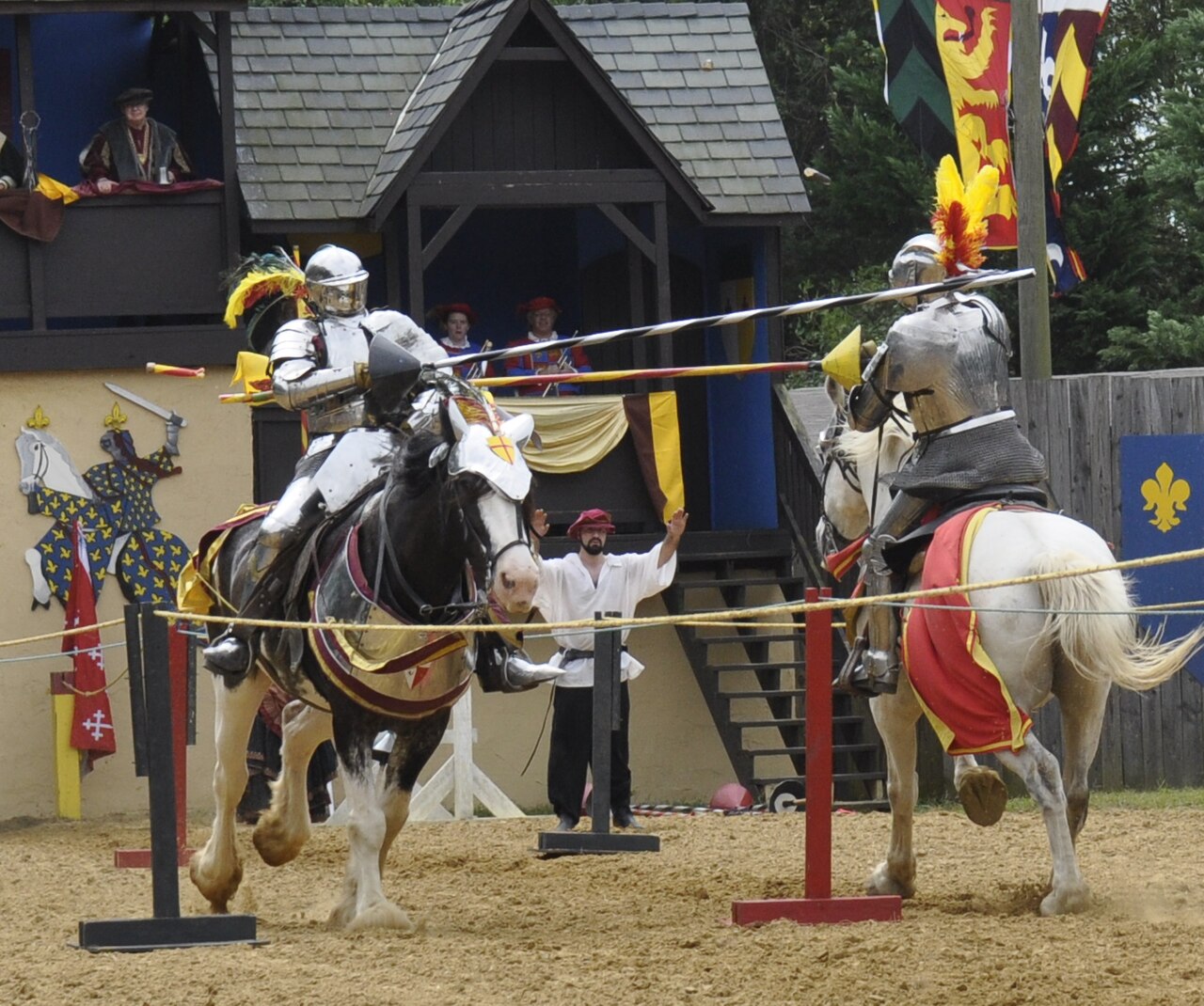 Two knights jousting, lance breaking on impact