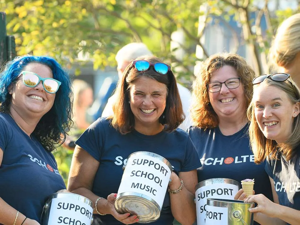 Volunteers collecting donations for school music programs at Jazz and Blues Live at the Station in Collingwood