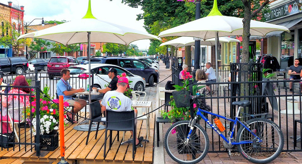 Downtown Collingwood patios, shops and cyclists representing PP08: Growing Opportunity