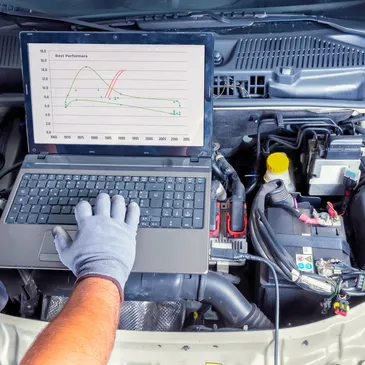 Diagnostic scan tool connected to a vehicle at Tate's Motorcar