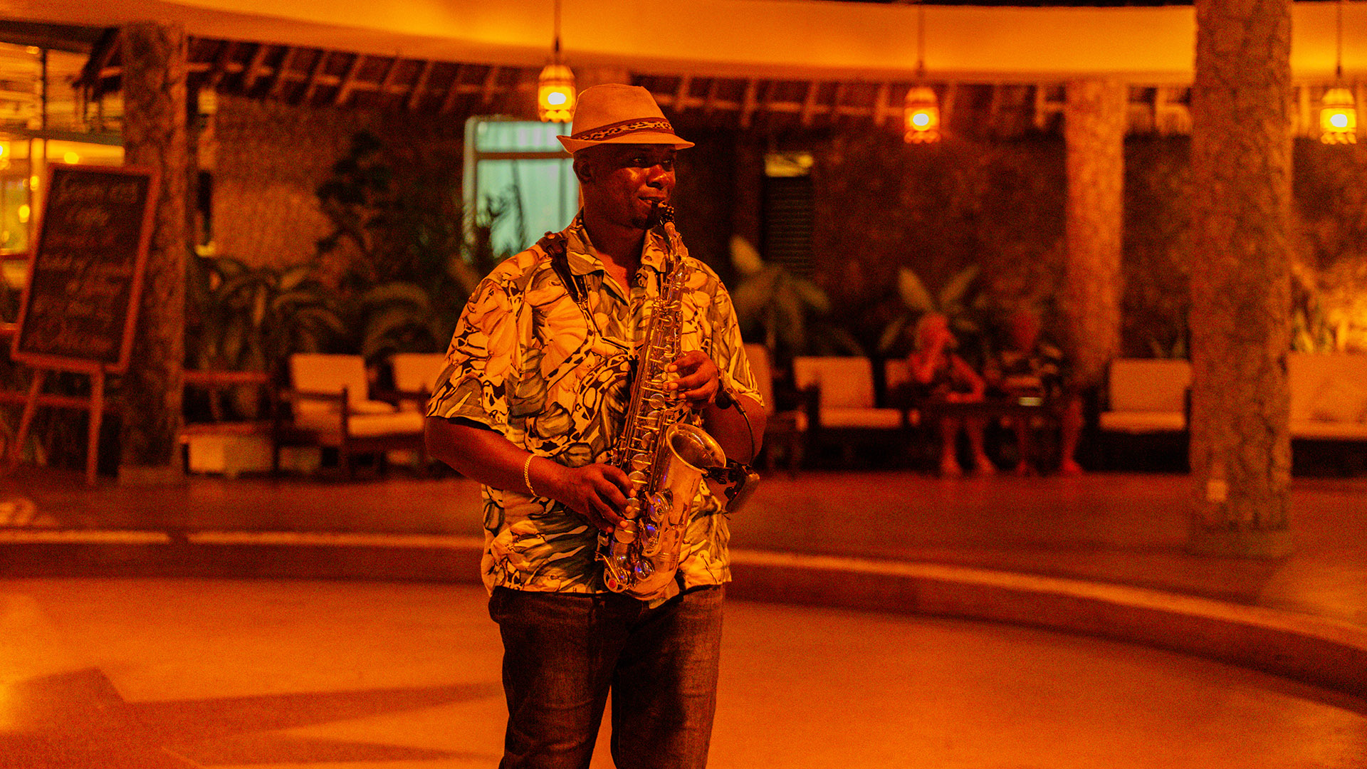 Live saxophone performance in a warmly lit North Coast resort lounge