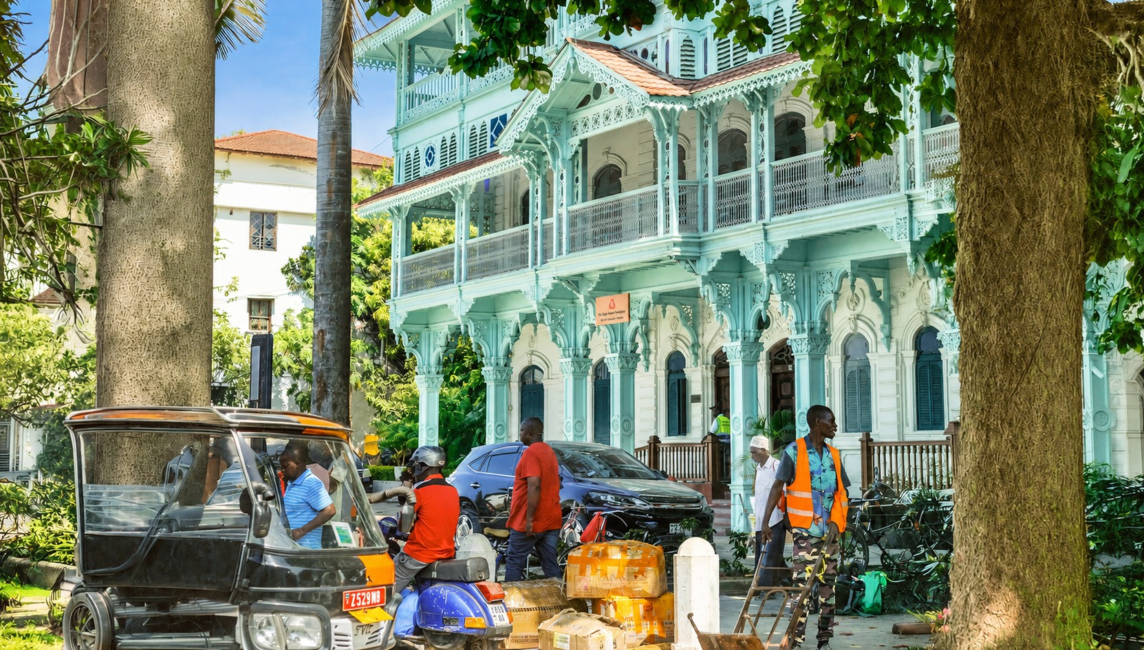 Historic light-blue building with ornate balconies in Mombasa Old Town