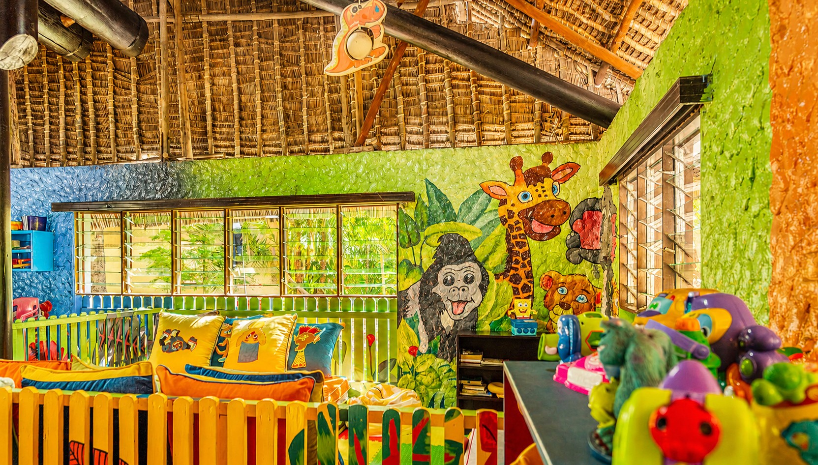 Kids club playroom with jungle animal murals and toys at Voyager Beach Resort, Mombasa