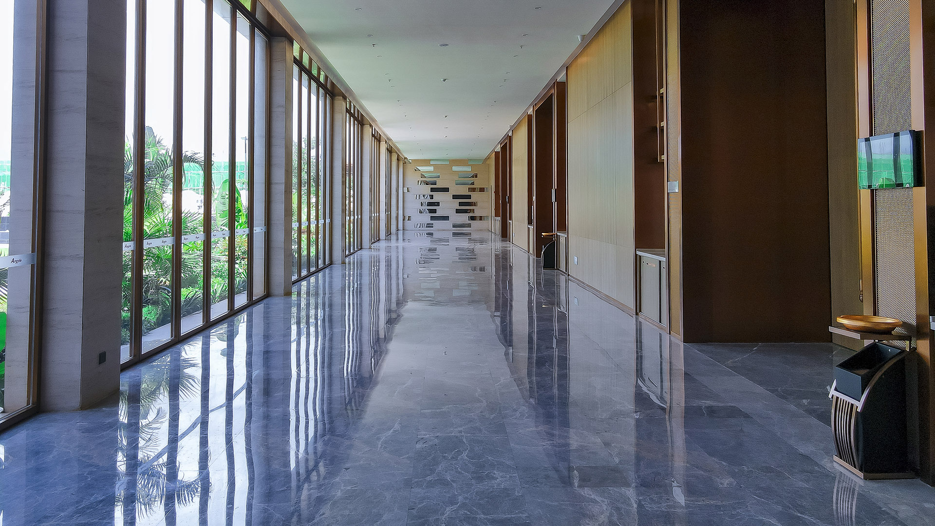 Bright marble corridor with garden views at Argyle Grand Hotel, Nairobi