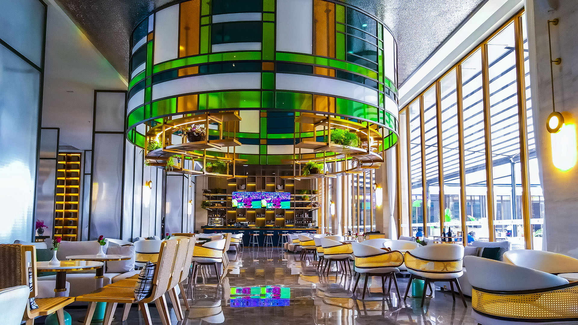 Hotel lounge and bar with stained-glass feature at Argyle Grand, Nairobi