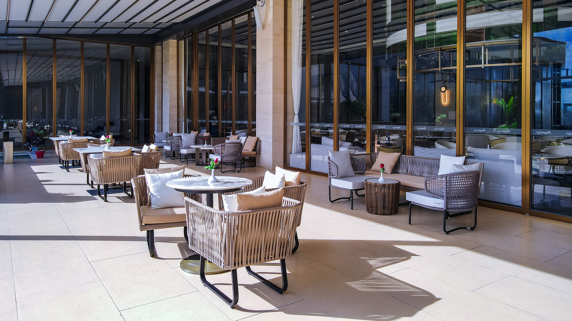 Outdoor terrace dining with woven chairs at Argyle Grand, Nairobi
