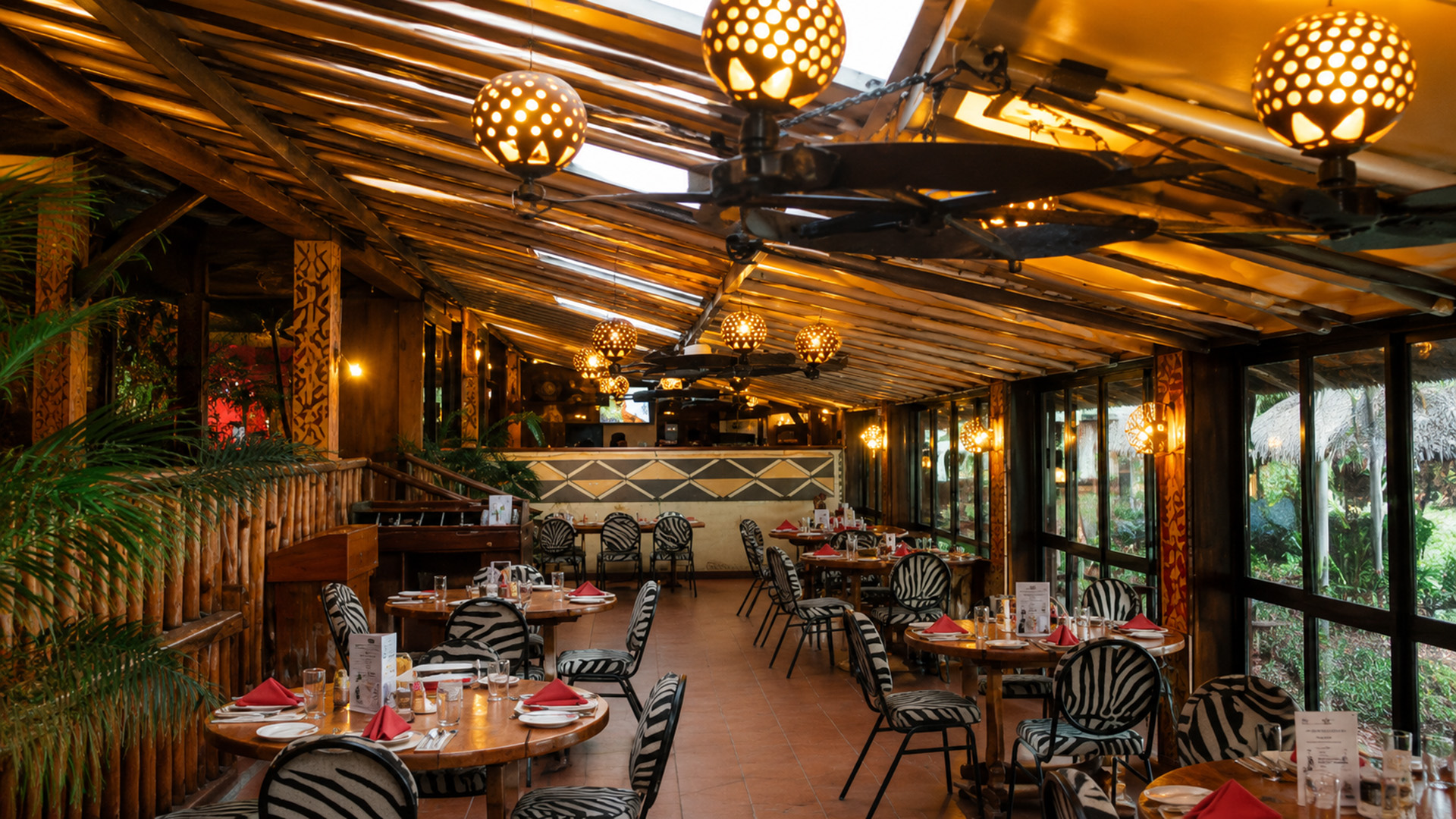 Safari-chic restaurant interior with zebra-print chairs in Nairobi